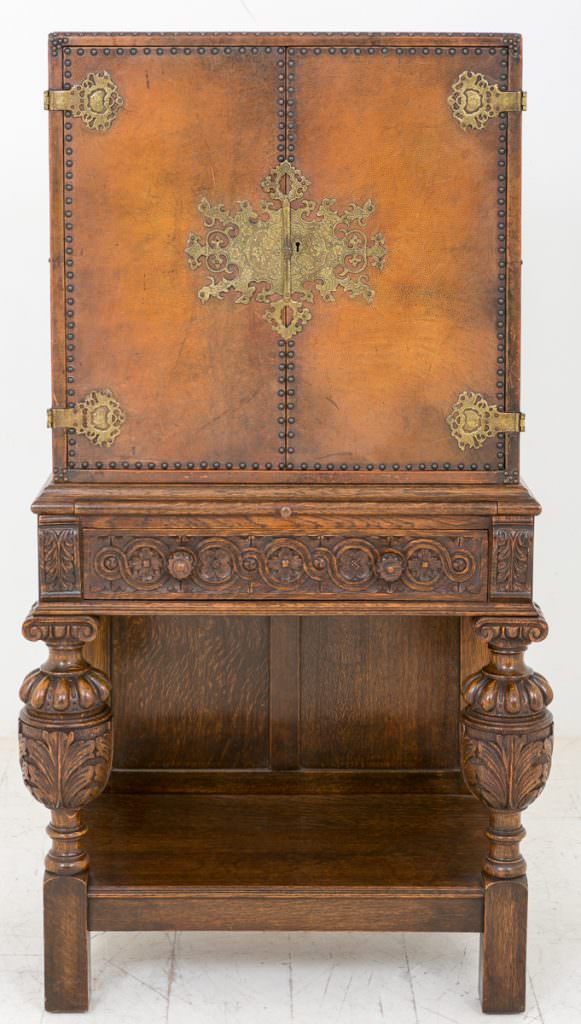 Unusual Carved Oak and Leather Cabinet