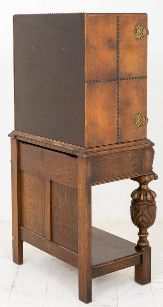 Unusual Carved Oak and Leather Cabinet