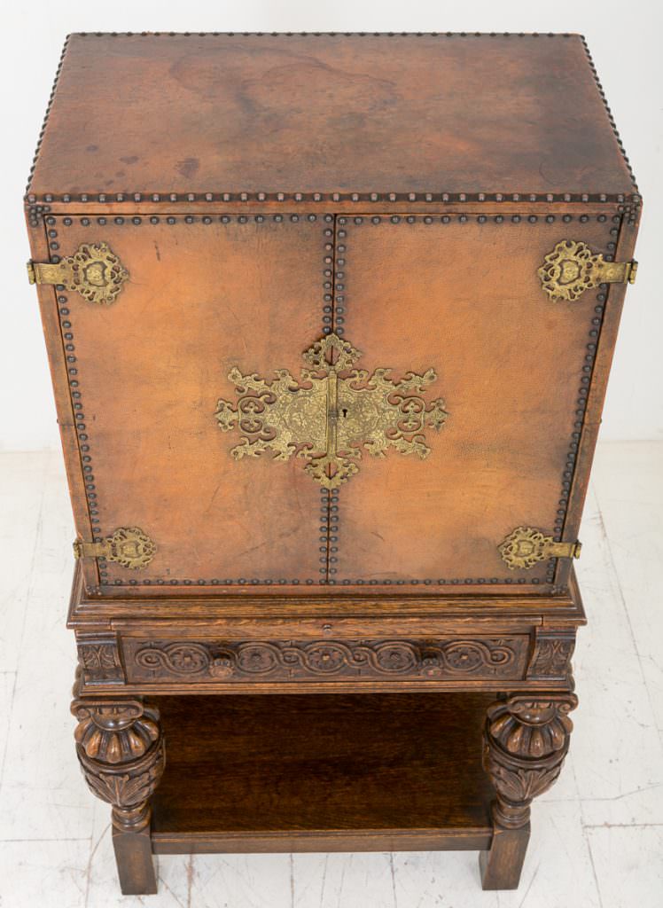 Unusual Carved Oak and Leather Cabinet