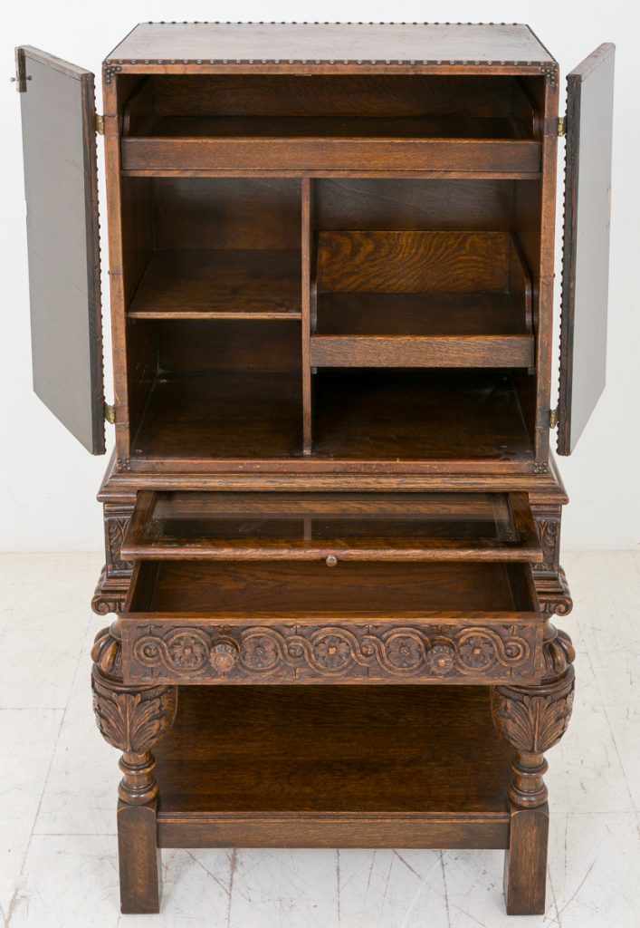Unusual Carved Oak and Leather Cabinet